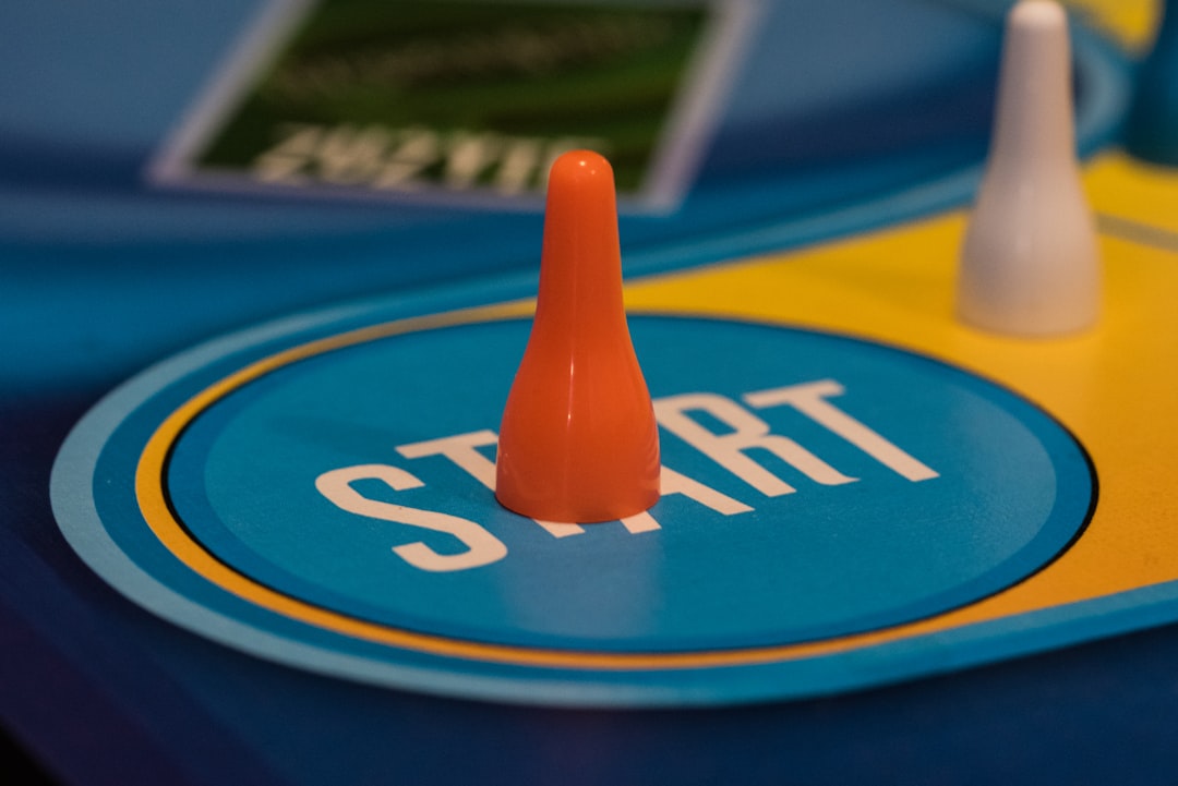 a-close-up-of-a-game-board-with-two-cones-ndiecok1nq